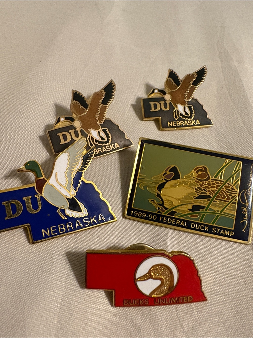 Set of 4 Ducks Unlimited Nebraska pins and 1989-1990 Federal Duck Stamp pin